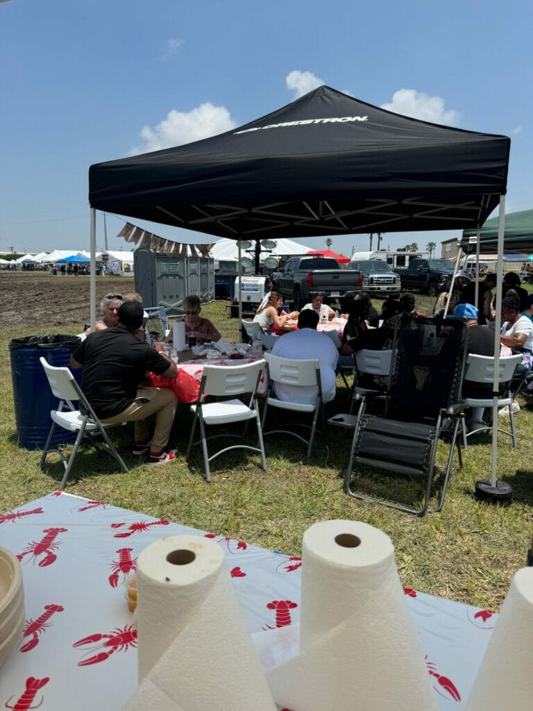 A Flavorful Partnership: STS and Data Projections at the Big Crawfish Bash 6 People enjoying the crawfish by the Data Projections Team